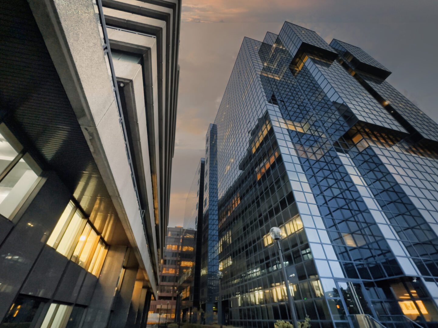 Modern glass skyscrapers at sunset